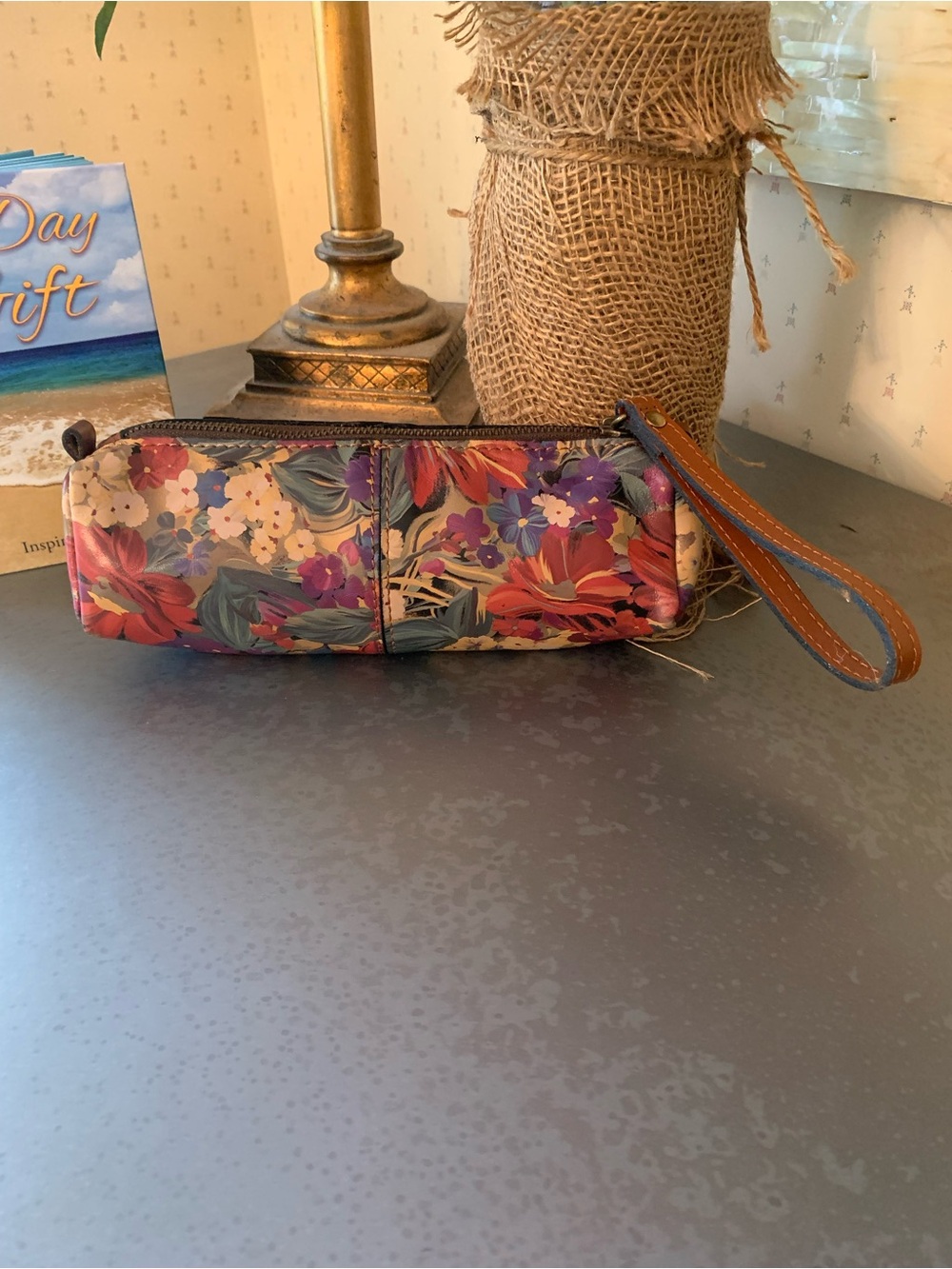 Patricia Nash Leather floral pattern wristlet, TAN leather strap. Zips.